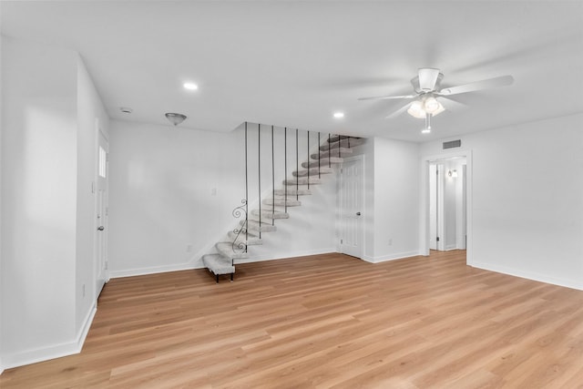 8124 Fondren Rd Unit 8124, Houston, TX 77074 - unfurnished living room featuring stairs, a ceiling fan, light wood-style floors, and recessed lighting