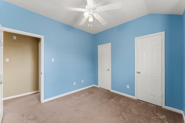28210 Slatestone Ln, Spring, TX 77386 - unfurnished bedroom with carpet flooring, lofted ceiling, and a ceiling fan