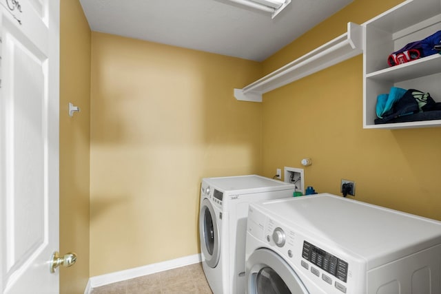 28210 Slatestone Ln, Spring, TX 77386 - laundry area with washer and clothes dryer and light tile patterned flooring