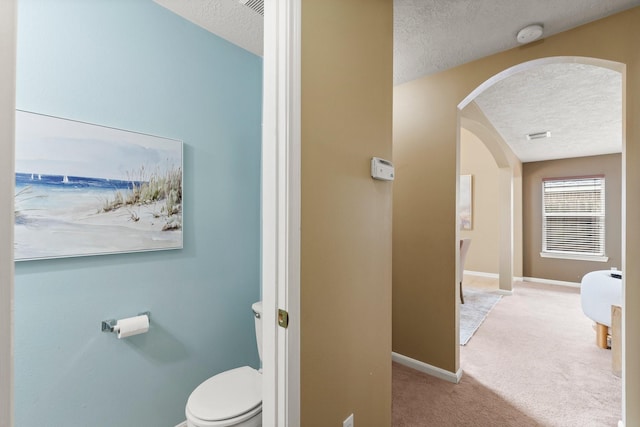 28210 Slatestone Ln, Spring, TX 77386 - bathroom with a textured ceiling and toilet