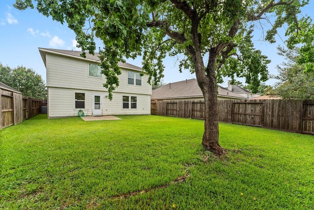 28210 Slatestone Ln, Spring, TX 77386 - rear view of property with a fenced backyard and a patio