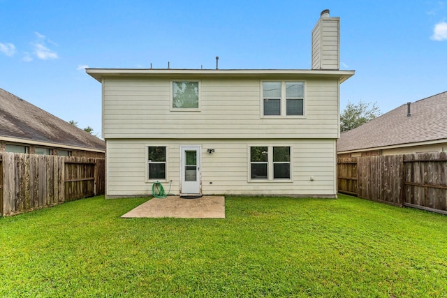 28210 Slatestone Ln, Spring, TX 77386 - back of house featuring a fenced backyard, a patio area, and a chimney