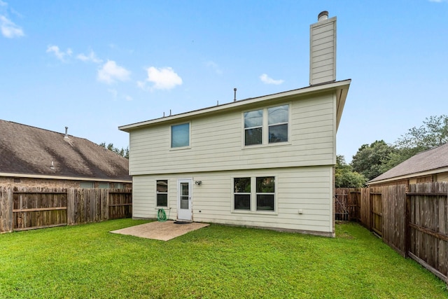 28210 Slatestone Ln, Spring, TX 77386 - rear view of house featuring a fenced backyard and a chimney
