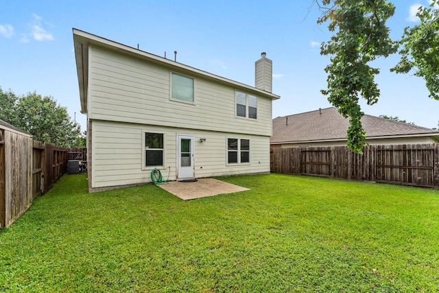 28210 Slatestone Ln, Spring, TX 77386 - rear view of property with a chimney and a fenced backyard