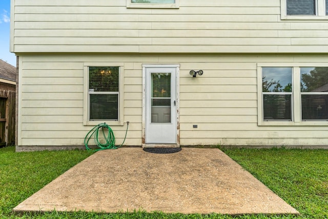 28210 Slatestone Ln, Spring, TX 77386 - entrance to property featuring a lawn and a patio area