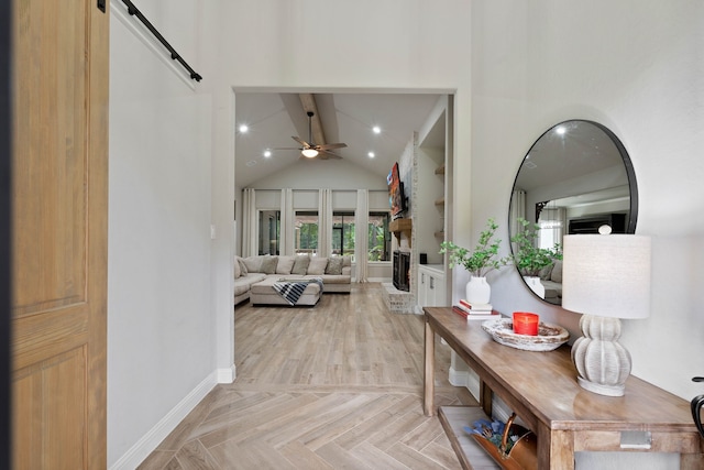 206 Rim Rock Rd, Huntsville, TX 77340 - hallway with beam ceiling, high vaulted ceiling, and a barn door