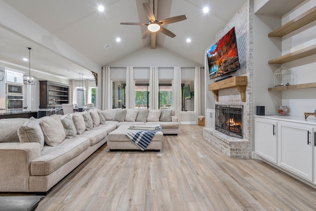 206 Rim Rock Rd, Huntsville, TX 77340 - living room featuring a fireplace, light wood finished floors, a ceiling fan, and recessed lighting