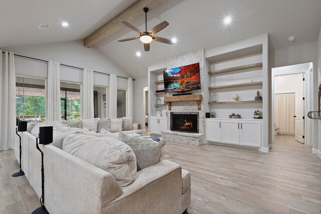 206 Rim Rock Rd, Huntsville, TX 77340 - living room with a ceiling fan, a fireplace, light wood-type flooring, and recessed lighting