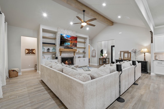 206 Rim Rock Rd, Huntsville, TX 77340 - living area featuring a ceiling fan, beam ceiling, a brick fireplace, light wood-type flooring, and recessed lighting