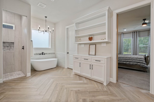 206 Rim Rock Rd, Huntsville, TX 77340 - ensuite bathroom featuring a freestanding tub, walk in shower, a chandelier, and a ceiling fan