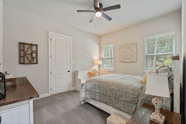 206 Rim Rock Rd, Huntsville, TX 77340 - carpeted bedroom with baseboards and a ceiling fan