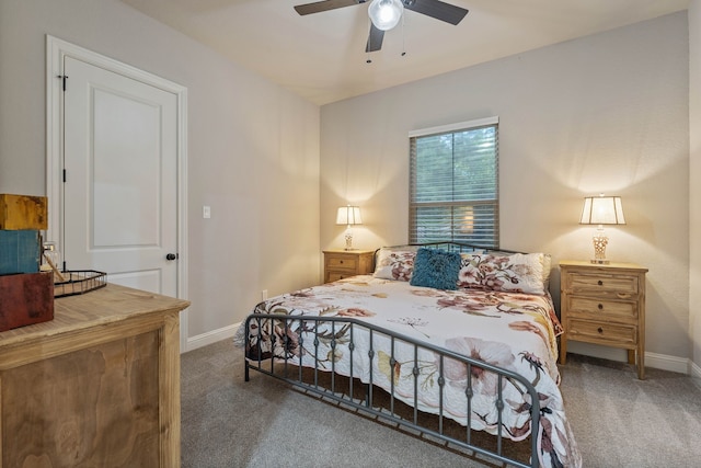 206 Rim Rock Rd, Huntsville, TX 77340 - carpeted bedroom featuring baseboards and ceiling fan