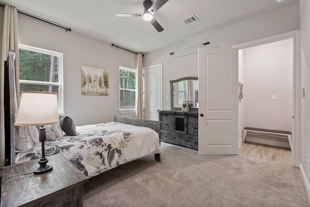 206 Rim Rock Rd, Huntsville, TX 77340 - bedroom featuring carpet floors, multiple windows, and ceiling fan