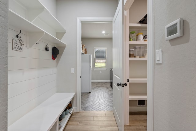 206 Rim Rock Rd, Huntsville, TX 77340 - mudroom with light wood-type flooring and baseboards