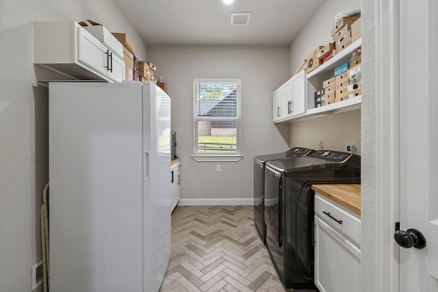 206 Rim Rock Rd, Huntsville, TX 77340 - laundry room with washer and clothes dryer and cabinet space