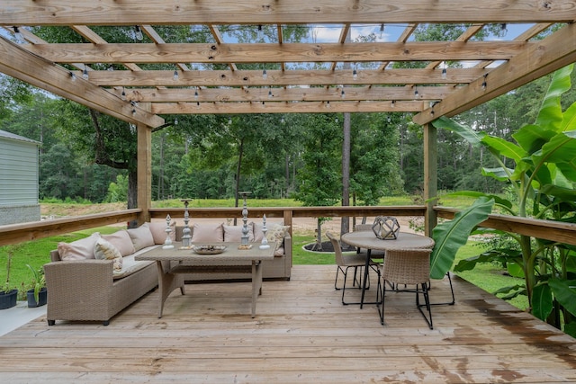 206 Rim Rock Rd, Huntsville, TX 77340 - wooden deck featuring an outdoor hangout area, a pergola, outdoor dining space, and view of scattered trees