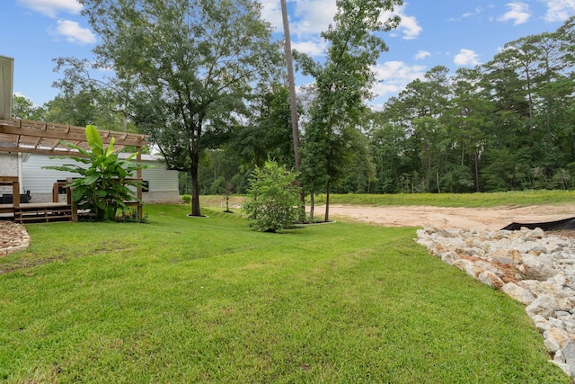 206 Rim Rock Rd, Huntsville, TX 77340 - view of grassy yard with a pergola