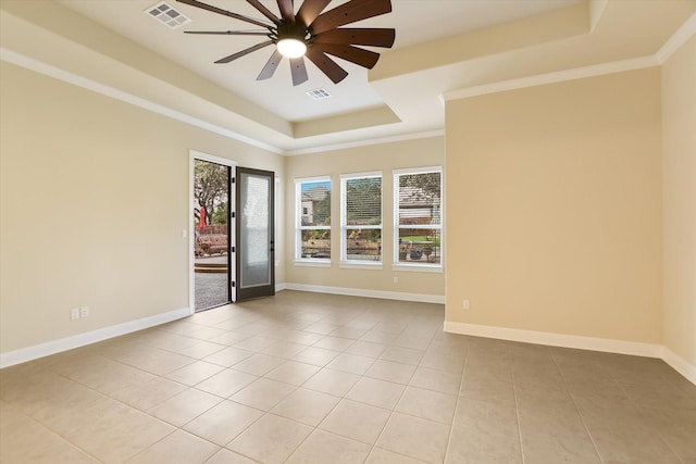 2728 Long Lasso Pass, Leander, TX 78641 - spare room featuring a raised ceiling, light tile patterned flooring, a ceiling fan, and crown molding