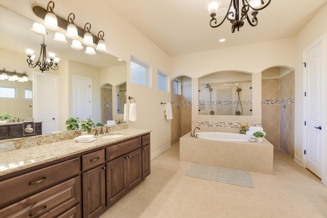 2728 Long Lasso Pass, Leander, TX 78641 - full bath featuring a chandelier, tile patterned flooring, walk in shower, a bath, and vanity