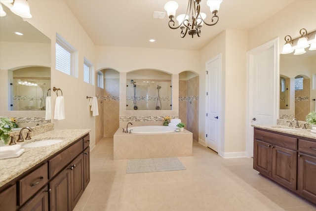 2728 Long Lasso Pass, Leander, TX 78641 - bathroom with a bath, tile patterned floors, walk in shower, two vanities, and a chandelier