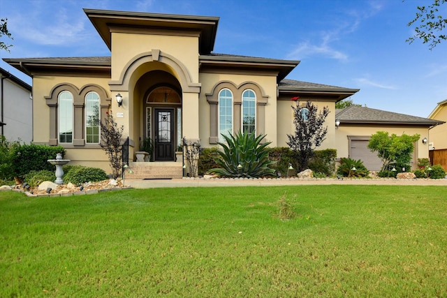 2728 Long Lasso Pass, Leander, TX 78641 - mediterranean / spanish house with a garage, a front lawn, and stucco siding