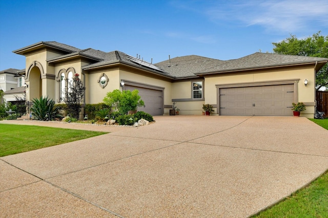 2728 Long Lasso Pass, Leander, TX 78641 - view of front of property with a garage, stucco siding, and driveway