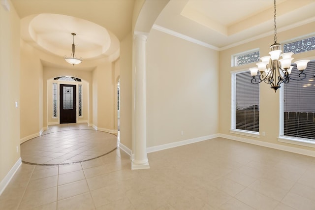 2728 Long Lasso Pass, Leander, TX 78641 - foyer featuring a tray ceiling, light tile patterned floors, a chandelier, and arched walkways