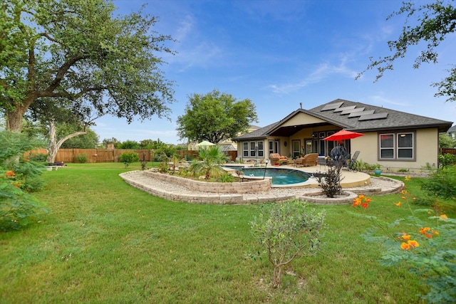 2728 Long Lasso Pass, Leander, TX 78641 - fenced backyard featuring a patio area and outdoor lounge area