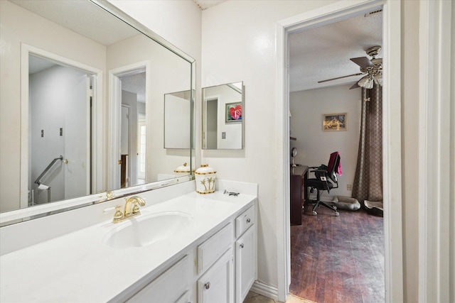 3907 Moss Tree Rd, Houston, TX 77043 - bathroom with vanity, a ceiling fan, and a textured ceiling
