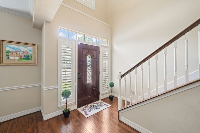 16447 Flint Run Way, Sugar Land, TX 77498 - entryway with wood finished floors, stairs, and ornamental molding