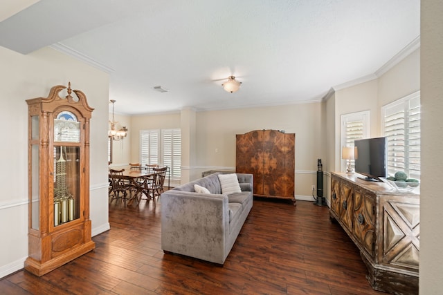 16447 Flint Run Way, Sugar Land, TX 77498 - living area with dark wood finished floors, ornamental molding, and a chandelier