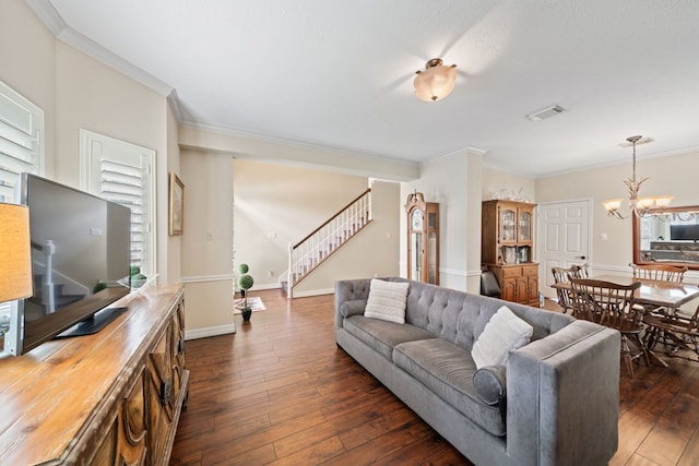 16447 Flint Run Way, Sugar Land, TX 77498 - living area featuring a chandelier, dark wood finished floors, ornamental molding, and stairway