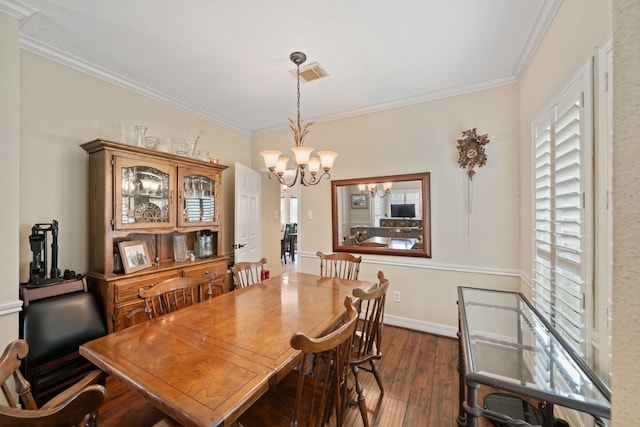 16447 Flint Run Way, Sugar Land, TX 77498 - dining space with a chandelier, dark wood-type flooring, crown molding, and plenty of natural light