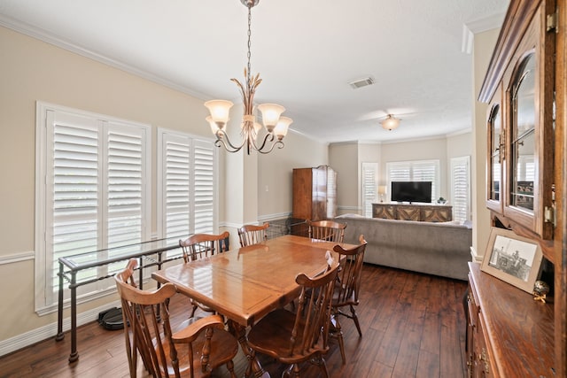 16447 Flint Run Way, Sugar Land, TX 77498 - dining space with crown molding, dark wood finished floors, and a chandelier