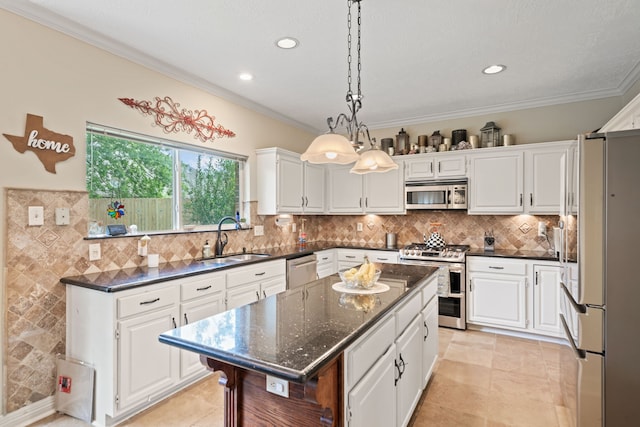 16447 Flint Run Way, Sugar Land, TX 77498 - kitchen with appliances with stainless steel finishes, crown molding, a center island, white cabinetry, and recessed lighting