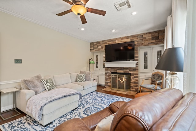 16447 Flint Run Way, Sugar Land, TX 77498 - living area with a ceiling fan, wood finished floors, crown molding, a fireplace, and recessed lighting