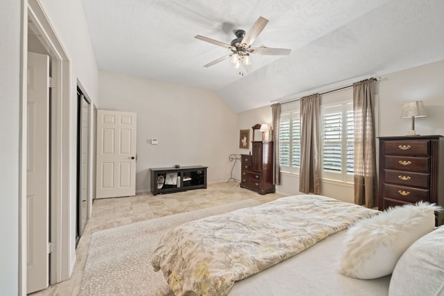 16447 Flint Run Way, Sugar Land, TX 77498 - bedroom featuring vaulted ceiling, a textured ceiling, and a ceiling fan
