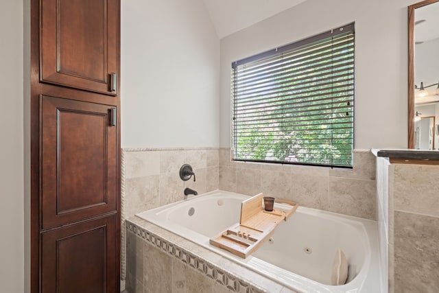 16447 Flint Run Way, Sugar Land, TX 77498 - bathroom with a tub with jets and lofted ceiling