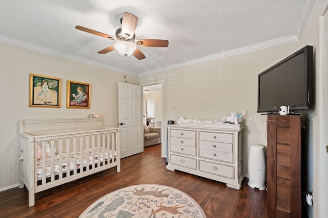16447 Flint Run Way, Sugar Land, TX 77498 - bedroom with wood finished floors, ornamental molding, a nursery area, a textured ceiling, and a ceiling fan