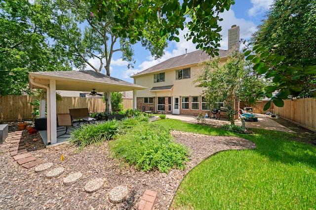 16447 Flint Run Way, Sugar Land, TX 77498 - back of property featuring a ceiling fan, a patio, a fenced backyard, and a chimney