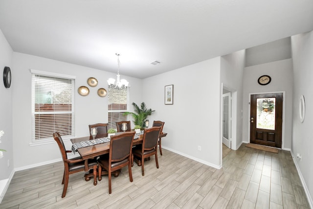 5206 Wyatt James Ln, Brookshire, TX 77423 - dining room featuring a chandelier and light wood-style flooring