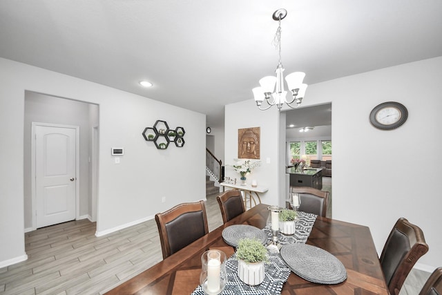 5206 Wyatt James Ln, Brookshire, TX 77423 - dining area featuring stairway, a chandelier, light wood-style floors, and recessed lighting