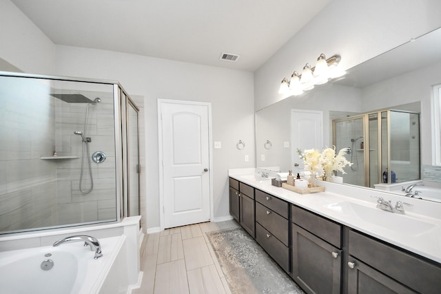 5206 Wyatt James Ln, Brookshire, TX 77423 - bathroom with a garden tub, double vanity, and a stall shower