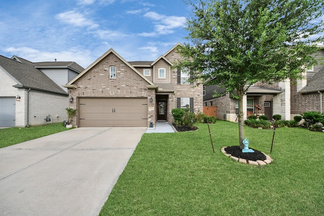 5206 Wyatt James Ln, Brookshire, TX 77423 - view of front of home with brick siding, concrete driveway, a front yard, and a garage