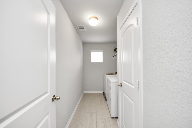 5206 Wyatt James Ln, Brookshire, TX 77423 - laundry area featuring independent washer and dryer and baseboards