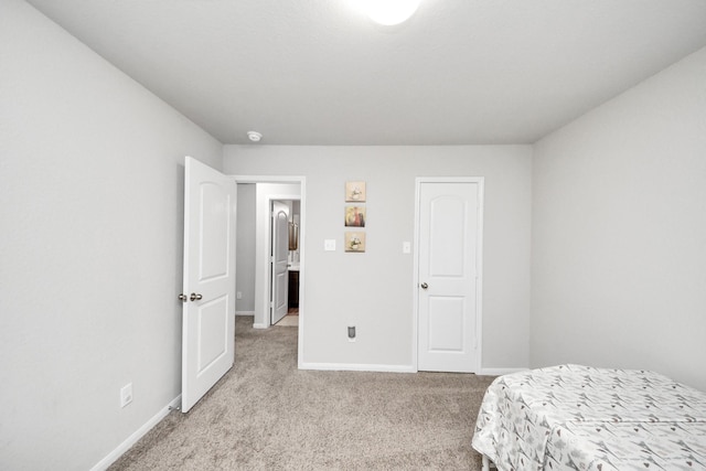 5206 Wyatt James Ln, Brookshire, TX 77423 - bedroom featuring light colored carpet and baseboards