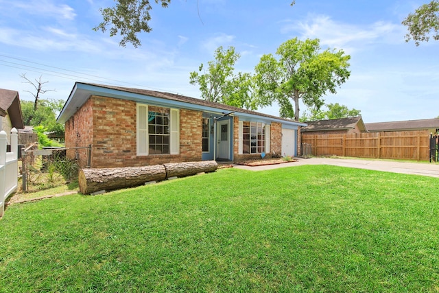 15050 Groveshire St, Channelview, TX 77530 - ranch-style home featuring concrete driveway, a garage, and brick siding