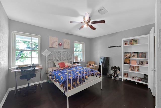 7403 Theisswood Rd, Spring, TX 77379 - bedroom with multiple windows, wood finished floors, and ceiling fan
