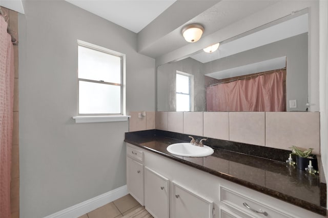 7403 Theisswood Rd, Spring, TX 77379 - full bathroom featuring vanity, tile patterned flooring, and tasteful backsplash