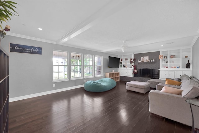 7403 Theisswood Rd, Spring, TX 77379 - living room with a brick fireplace, wood finished floors, ornamental molding, recessed lighting, and built in shelves